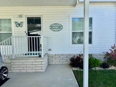 Welcome home to this impeccable 2-bedroom 2-bath sanctuary on Cypresswood Golf and Country Club in Florida - for sale on GolfHomes.com, golf home, golf lot