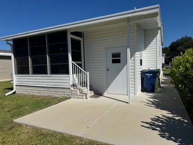 Welcome home to this impeccable 2-bedroom 2-bath sanctuary on Cypresswood Golf and Country Club in Florida - for sale on GolfHomes.com, golf home, golf lot