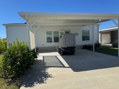 Welcome home to this impeccable 2-bedroom 2-bath sanctuary on Cypresswood Golf and Country Club in Florida - for sale on GolfHomes.com, golf home, golf lot