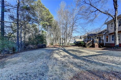Nestled along the 5th fairway, this beautifully positioned home on Country Club of Roswell in Georgia - for sale on GolfHomes.com, golf home, golf lot