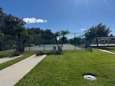 Welcome home to this impeccable 2-bedroom 2-bath sanctuary on Cypresswood Golf and Country Club in Florida - for sale on GolfHomes.com, golf home, golf lot