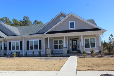 Enjoy easy, single-level, maintenance-free living in this on Cape Fear National At Brunswick Forest in North Carolina - for sale on GolfHomes.com, golf home, golf lot