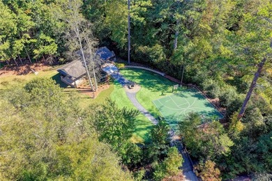 Nestled along the 5th fairway, this beautifully positioned home on Country Club of Roswell in Georgia - for sale on GolfHomes.com, golf home, golf lot