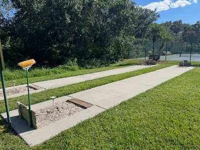Welcome home to this impeccable 2-bedroom 2-bath sanctuary on Cypresswood Golf and Country Club in Florida - for sale on GolfHomes.com, golf home, golf lot