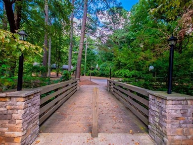Nestled along the 5th fairway, this beautifully positioned home on Country Club of Roswell in Georgia - for sale on GolfHomes.com, golf home, golf lot