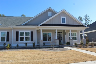 Enjoy easy, single-level, maintenance-free living in this on Cape Fear National At Brunswick Forest in North Carolina - for sale on GolfHomes.com, golf home, golf lot