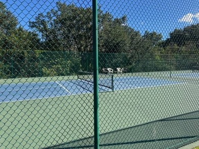 Welcome home to this impeccable 2-bedroom 2-bath sanctuary on Cypresswood Golf and Country Club in Florida - for sale on GolfHomes.com, golf home, golf lot