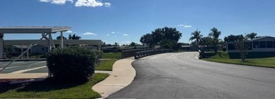 Welcome home to this impeccable 2-bedroom 2-bath sanctuary on Cypresswood Golf and Country Club in Florida - for sale on GolfHomes.com, golf home, golf lot