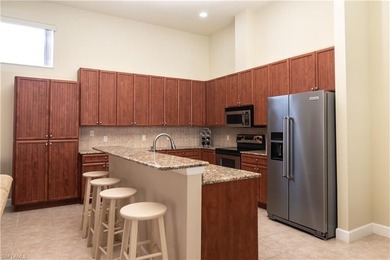 This spacious Courtyard Home is located in the exclusive Gated on Spanish Wells Golf and Country Club in Florida - for sale on GolfHomes.com, golf home, golf lot