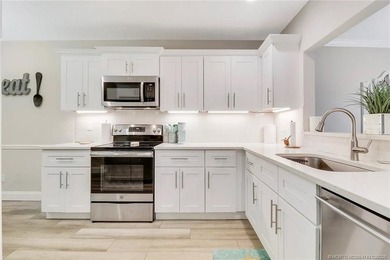 Light, bright, and perfectly located! This beautifully updated on Martin County Golf Course in Florida - for sale on GolfHomes.com, golf home, golf lot