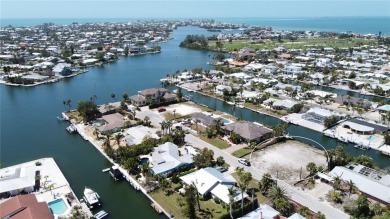 Here is your perfect chance to build your dream waterfront home on Key Royale Club in Florida - for sale on GolfHomes.com, golf home, golf lot