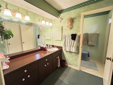 Located on a cul-de-sac, this 2 bedroom home overlooks a on Cypresswood Golf and Country Club in Florida - for sale on GolfHomes.com, golf home, golf lot