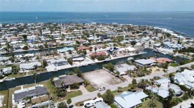 Here is your perfect chance to build your dream waterfront home on Key Royale Club in Florida - for sale on GolfHomes.com, golf home, golf lot