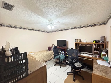 Located on a cul-de-sac, this 2 bedroom home overlooks a on Cypresswood Golf and Country Club in Florida - for sale on GolfHomes.com, golf home, golf lot