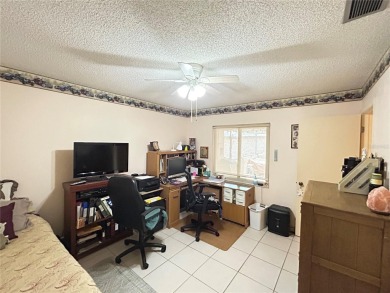 Located on a cul-de-sac, this 2 bedroom home overlooks a on Cypresswood Golf and Country Club in Florida - for sale on GolfHomes.com, golf home, golf lot