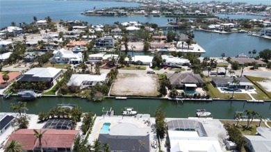 Here is your perfect chance to build your dream waterfront home on Key Royale Club in Florida - for sale on GolfHomes.com, golf home, golf lot