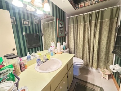 Located on a cul-de-sac, this 2 bedroom home overlooks a on Cypresswood Golf and Country Club in Florida - for sale on GolfHomes.com, golf home, golf lot