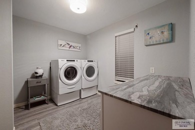 Welcome to this beautifully maintained 5-bedroom, 3-bath home on Brownsville Golf Center in Texas - for sale on GolfHomes.com, golf home, golf lot