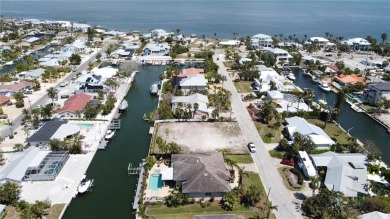 Here is your perfect chance to build your dream waterfront home on Key Royale Club in Florida - for sale on GolfHomes.com, golf home, golf lot