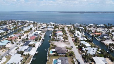 Here is your perfect chance to build your dream waterfront home on Key Royale Club in Florida - for sale on GolfHomes.com, golf home, golf lot