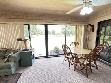 Located on a cul-de-sac, this 2 bedroom home overlooks a on Cypresswood Golf and Country Club in Florida - for sale on GolfHomes.com, golf home, golf lot