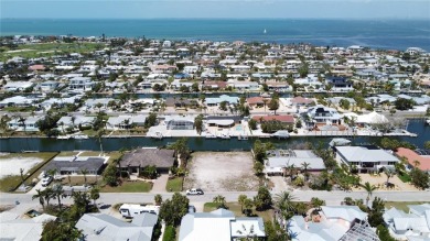 Here is your perfect chance to build your dream waterfront home on Key Royale Club in Florida - for sale on GolfHomes.com, golf home, golf lot