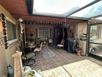 Located on a cul-de-sac, this 2 bedroom home overlooks a on Cypresswood Golf and Country Club in Florida - for sale on GolfHomes.com, golf home, golf lot