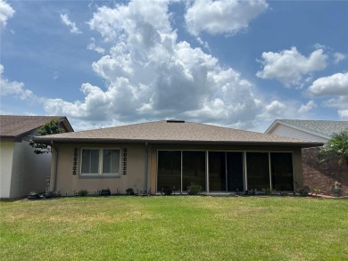 Located on a cul-de-sac, this 2 bedroom home overlooks a on Cypresswood Golf and Country Club in Florida - for sale on GolfHomes.com, golf home, golf lot