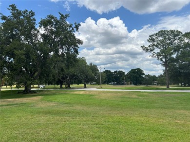 Located on a cul-de-sac, this 2 bedroom home overlooks a on Cypresswood Golf and Country Club in Florida - for sale on GolfHomes.com, golf home, golf lot