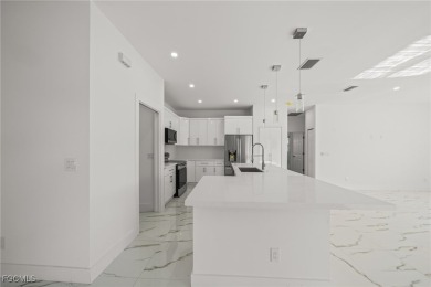 Stunning brand new modern home offering 3 bedrooms plus a on Del Tura Golf and Country Club in Florida - for sale on GolfHomes.com, golf home, golf lot