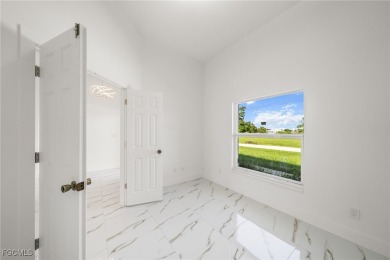 Stunning brand new modern home offering 3 bedrooms plus a on Del Tura Golf and Country Club in Florida - for sale on GolfHomes.com, golf home, golf lot