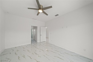 Stunning brand new modern home offering 3 bedrooms plus a on Del Tura Golf and Country Club in Florida - for sale on GolfHomes.com, golf home, golf lot