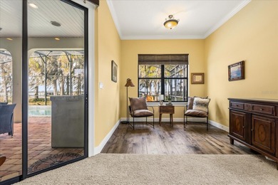 Set along approximately 82 feet of shimmering Lake Dora on Deer Island Country Club in Florida - for sale on GolfHomes.com, golf home, golf lot