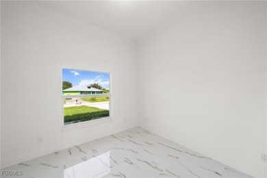 Stunning brand new modern home offering 3 bedrooms plus a on Del Tura Golf and Country Club in Florida - for sale on GolfHomes.com, golf home, golf lot