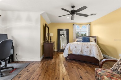 Set along approximately 82 feet of shimmering Lake Dora on Deer Island Country Club in Florida - for sale on GolfHomes.com, golf home, golf lot