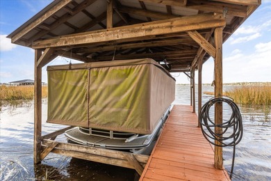 Set along approximately 82 feet of shimmering Lake Dora on Deer Island Country Club in Florida - for sale on GolfHomes.com, golf home, golf lot