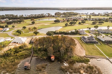 Set along approximately 82 feet of shimmering Lake Dora on Deer Island Country Club in Florida - for sale on GolfHomes.com, golf home, golf lot