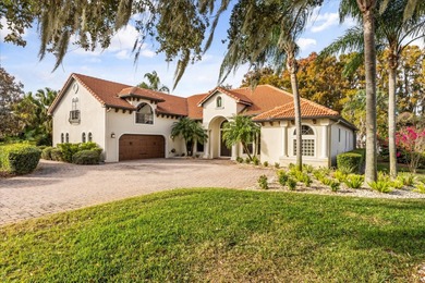 Set along approximately 82 feet of shimmering Lake Dora on Deer Island Country Club in Florida - for sale on GolfHomes.com, golf home, golf lot