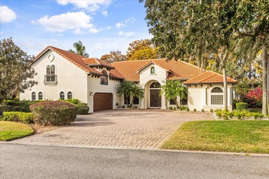 Set along approximately 82 feet of shimmering Lake Dora on Deer Island Country Club in Florida - for sale on GolfHomes.com, golf home, golf lot