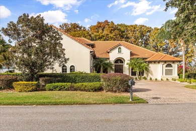 Set along approximately 82 feet of shimmering Lake Dora on Deer Island Country Club in Florida - for sale on GolfHomes.com, golf home, golf lot
