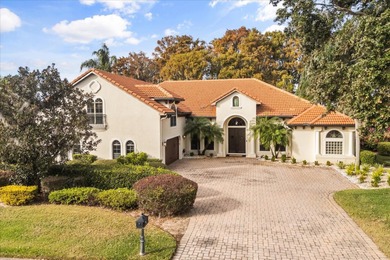 Set along approximately 82 feet of shimmering Lake Dora on Deer Island Country Club in Florida - for sale on GolfHomes.com, golf home, golf lot