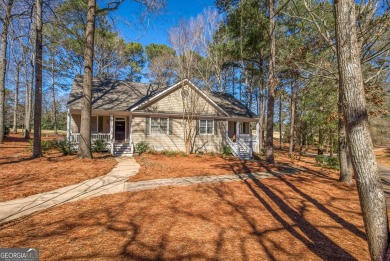 Sought after gated community at Reynolds-Lake Oconee with golf on Great Waters Course At Reynolds Plantation in Georgia - for sale on GolfHomes.com, golf home, golf lot