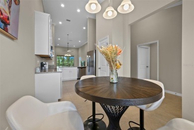 Experience refined living in this elegant second-floor residence on Esplanade Golf and Country at Lakewood Ranch in Florida - for sale on GolfHomes.com, golf home, golf lot