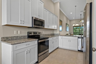 Experience refined living in this elegant second-floor residence on Esplanade Golf and Country at Lakewood Ranch in Florida - for sale on GolfHomes.com, golf home, golf lot