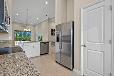 Experience refined living in this elegant second-floor residence on Esplanade Golf and Country at Lakewood Ranch in Florida - for sale on GolfHomes.com, golf home, golf lot
