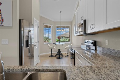 Experience refined living in this elegant second-floor residence on Esplanade Golf and Country at Lakewood Ranch in Florida - for sale on GolfHomes.com, golf home, golf lot