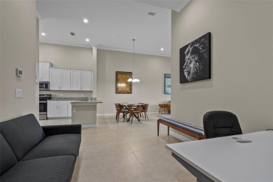Experience refined living in this elegant second-floor residence on Esplanade Golf and Country at Lakewood Ranch in Florida - for sale on GolfHomes.com, golf home, golf lot