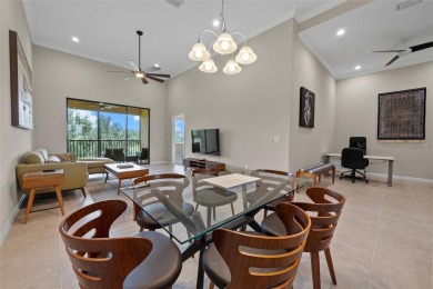Experience refined living in this elegant second-floor residence on Esplanade Golf and Country at Lakewood Ranch in Florida - for sale on GolfHomes.com, golf home, golf lot