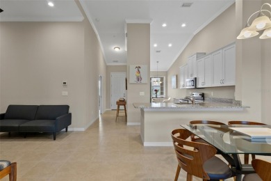 Experience refined living in this elegant second-floor residence on Esplanade Golf and Country at Lakewood Ranch in Florida - for sale on GolfHomes.com, golf home, golf lot