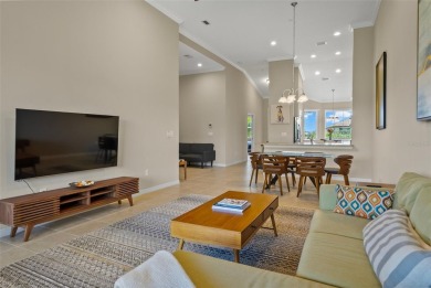 Experience refined living in this elegant second-floor residence on Esplanade Golf and Country at Lakewood Ranch in Florida - for sale on GolfHomes.com, golf home, golf lot
